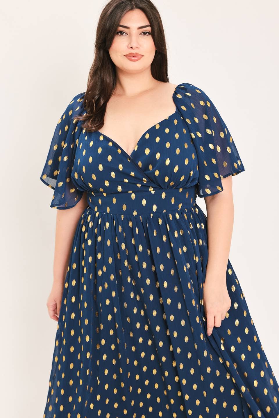 A solid woven with foil print midi dress